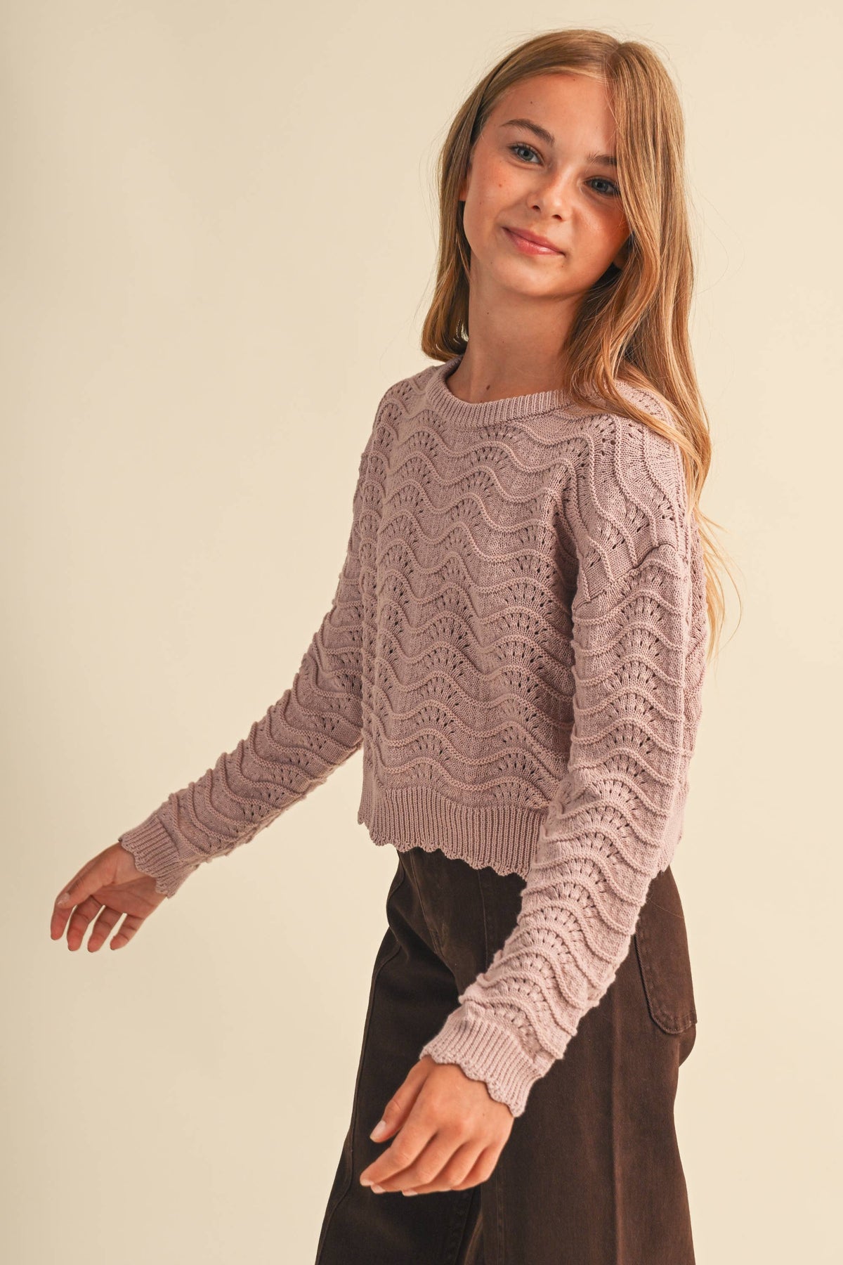 A young woman modeling a dusty mauve