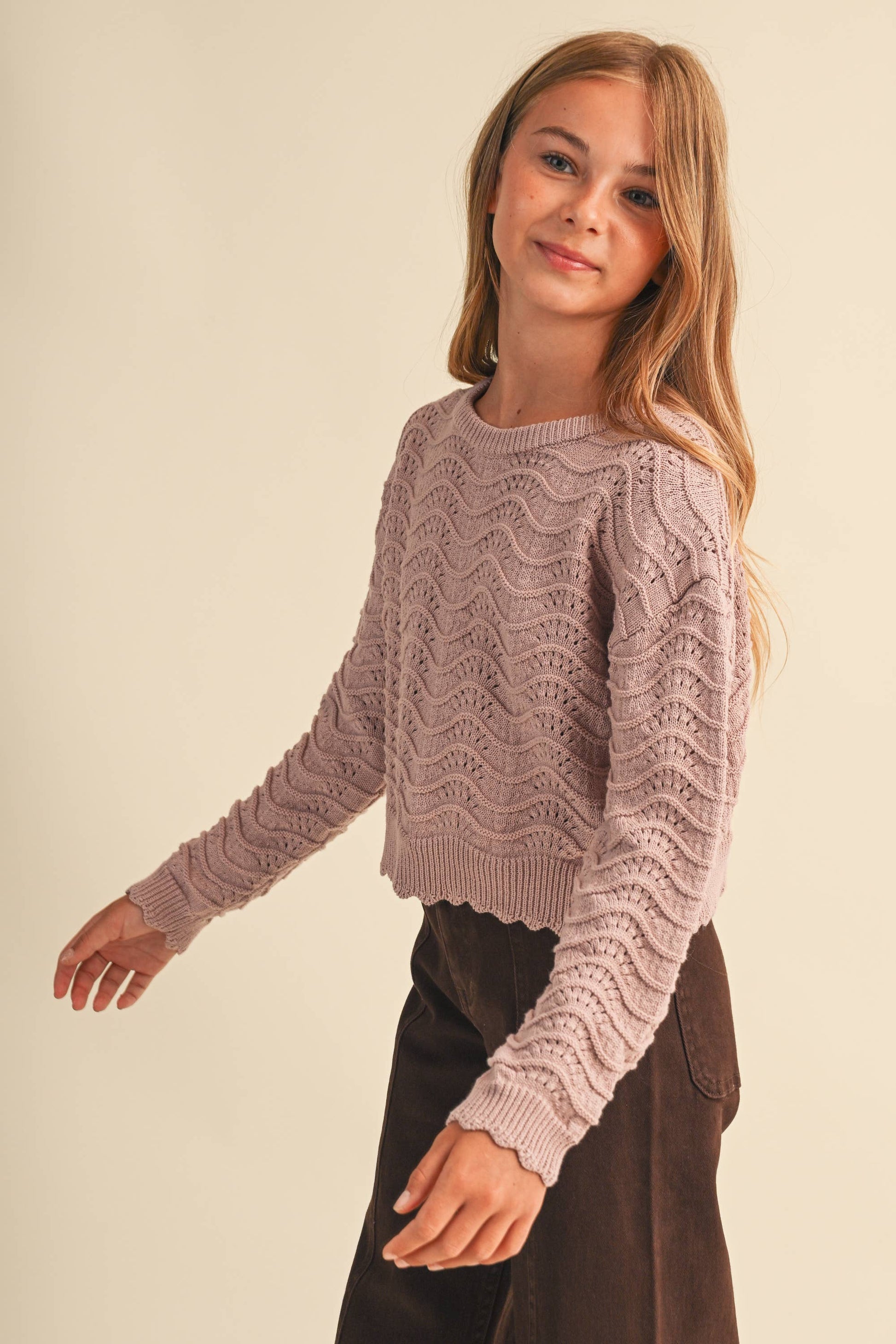 A young woman modeling a dusty mauve